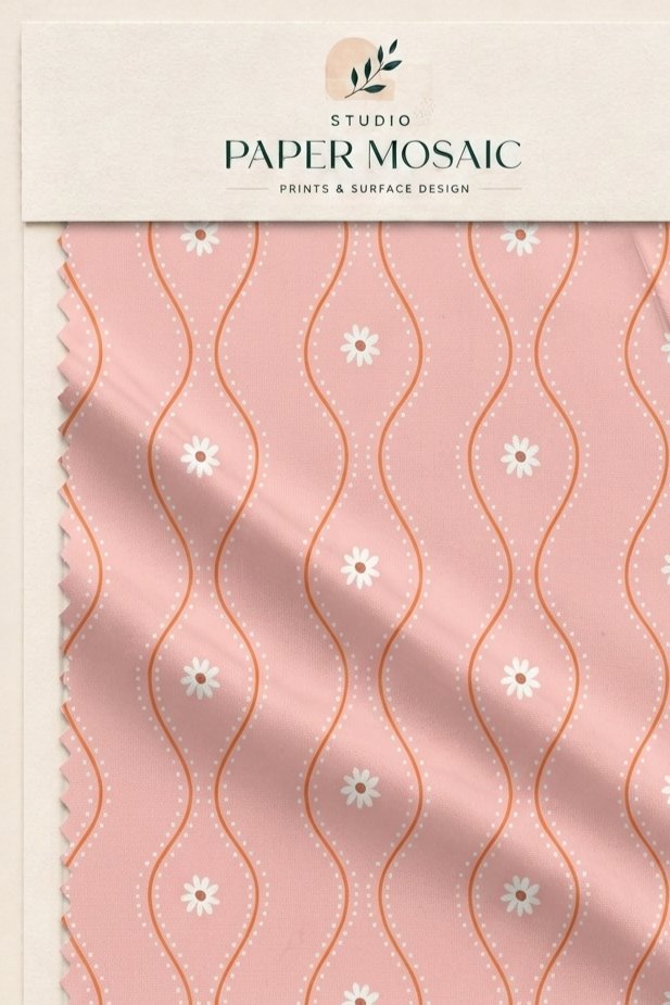 Pink textile with a flowing geometric trellis