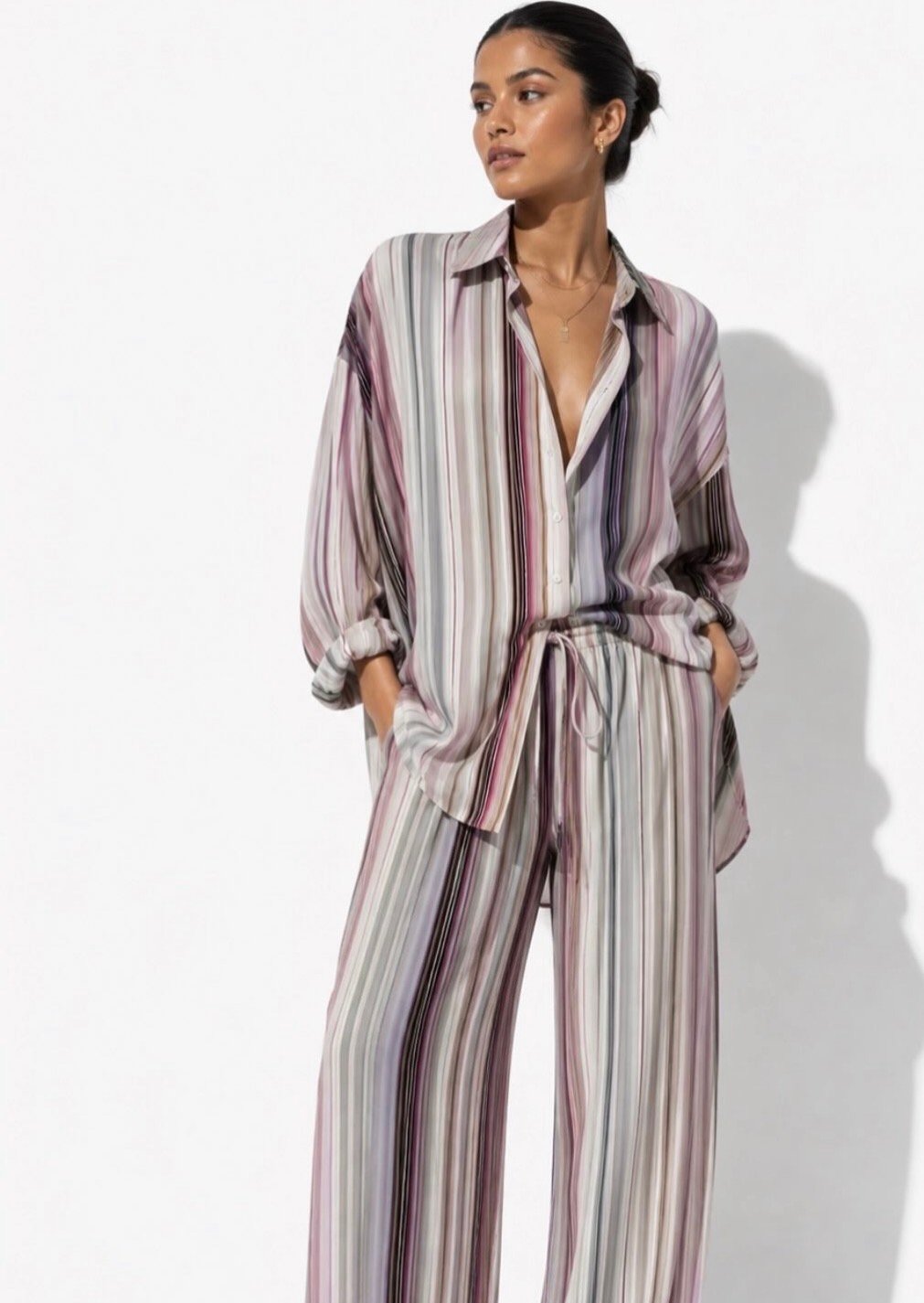 Model wearing a lavender striped outfit