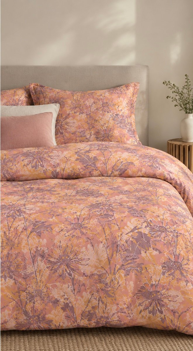 Bedsheet featuring meadow silhouettes in terracotta, ochre and mauve