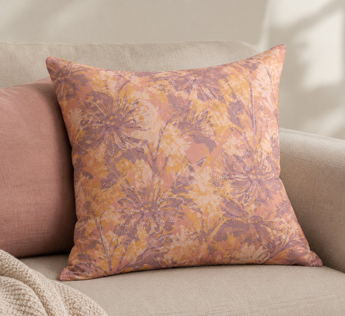Pillow featuring meadow silhouettes in terracotta, ochre and mauve